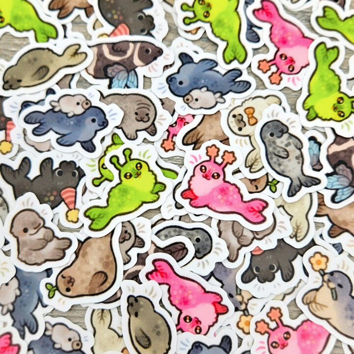 Picture of a variety of small, colorful animal stickers.